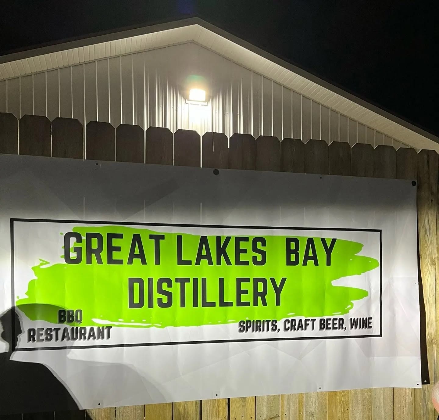 The Great Lakes Bay Distillery banner on the barn