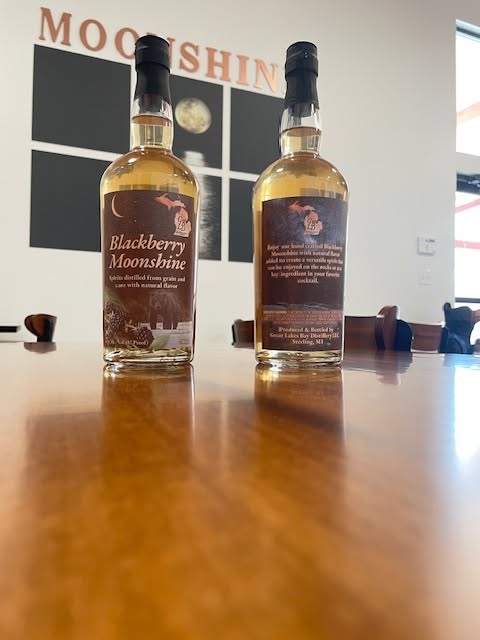 Blackberry Moonshine bottles on the tasting room bar